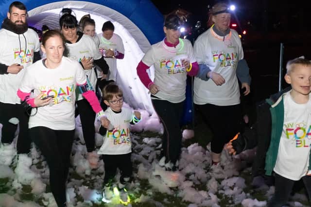 Pictured is: Some of participants emerge from the foam. Picture: Keith Woodland (090319-111)