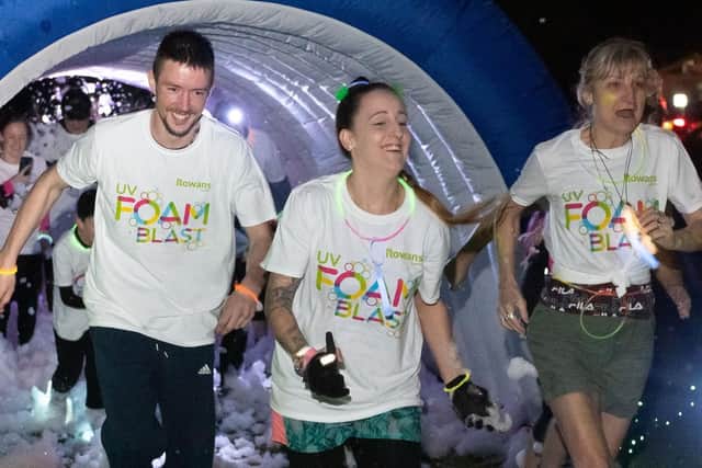 Pictured is: Some of participants emerge from the foam. Picture: Keith Woodland (090319-110)