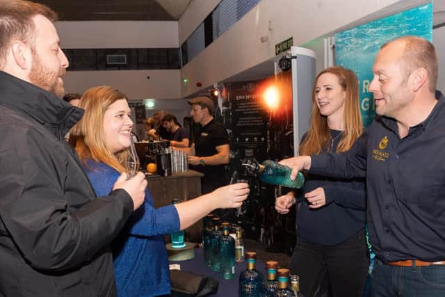 Ben and Rachael of served some Mermaid Gin by Ginnie Taylor and Xavier Baker from the IOW. Picture: Keith Woodland (090319-15)