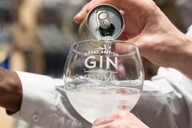 Pictured is: Adding a dash of tonic to a gin. Picture: Keith Woodland (090319-24)