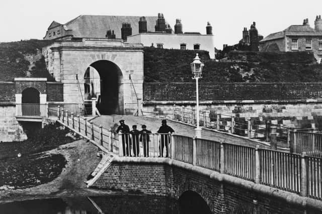 An archway and bridge Portsmouth, Hampshire, 1900. (Photo by F. J. Mortimer/Hulton Archive/Getty Images)