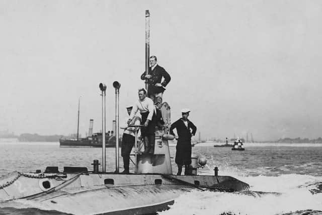 Officers and crew stand on deck around the conning tower of the second Royal Navy Holland-class submarine HMS Holland 2 on patrol entering Fort Blockhouse submarine base near Gosport circa 1905 off Gosport, United Kingdom. (Photo by Paul Thompson/FPG/Getty Images)