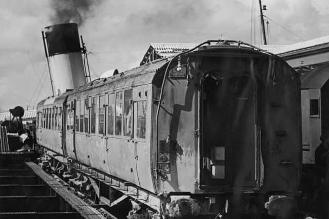 Salvaged coaches from a Southern Railway electric train after they were lifted from Portsmouth harbour, 12th September 1946. The coaches sank during a World War II air raid. (Photo by Harry Todd/Fox Photos/Hulton Archive/Getty Images)