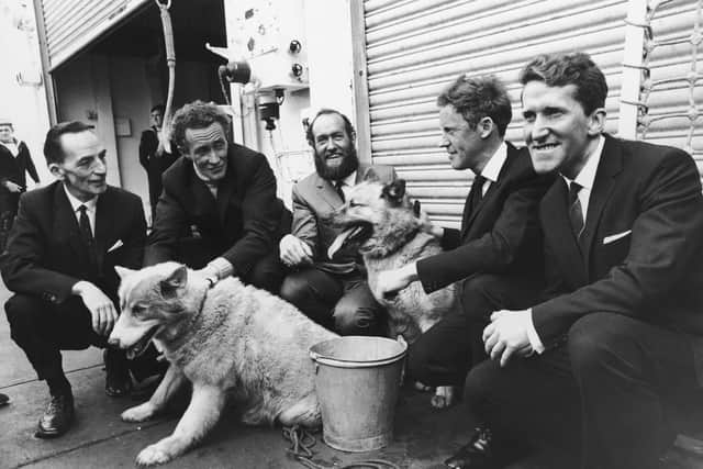 British explorer Wally Herbert, the first man to walk to the North Pole, returns to Portsmouth aboard the HMS Endurance after his 3,800 mile trek across the Arctic, 23rd June 1969. From left to right, his team are squadron leader Freddie Church, general assistant Alan Gill, group leader Herbert, glaciologist Roy Koerner and medical officer Kenneth Hedges. With them are two of the expedition's huskies, Eskimo Nell and Apple Dog. (Photo by Ron Case/Keystone/Hulton Archive/Getty Images)