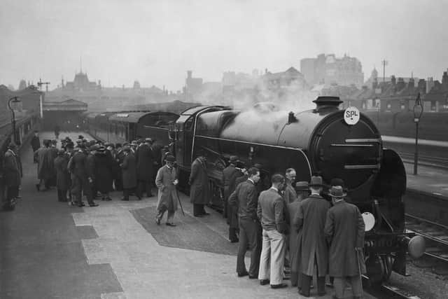 Visitors look over the Lord Nelson Class locomotive, Lord Hawke, during a train exhibition at Portsmouth Town Station, 21st October 1933. (Photo by J. A. Hampton/Topical Press Agency/Hulton Archive/Getty Images)