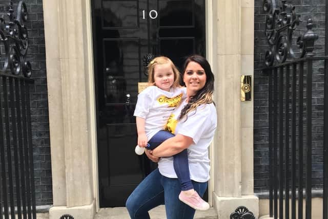 Gemma Weir with her five-year-old daughter Ivy, from Portsmouth, after she delivered hundreds of letters to Downing Street calling for drug Orkambi to be free.