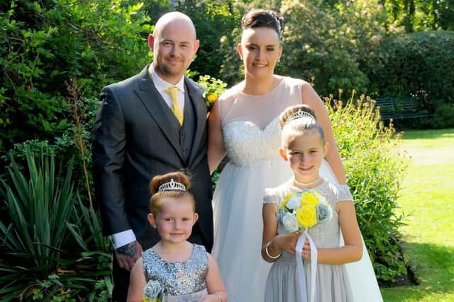 Natalie and Jay with their daughters Poppie-Rae, left, and Lacie-Mae. Picture: Mark Robbins Photography