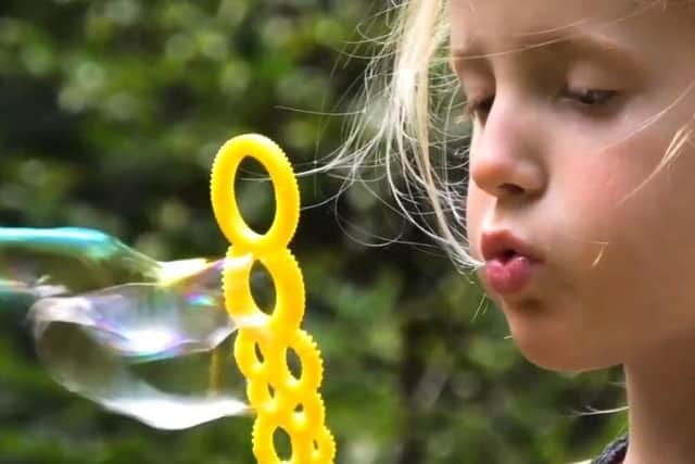 Emma blowing bubbles in the 'Breathe With Me' music video. Picture: UK CF