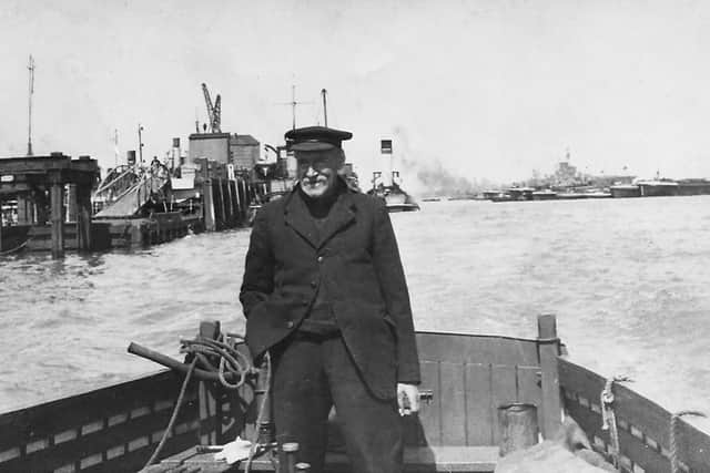 Pictured at the helm of his barge we see regular Portsmouth Harbour waterman Richard (Dickie) Dyer.