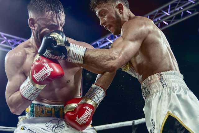 Michael Mckinson on his way to victory over Ryan Kelly. Picture: Scott Rawsthorne/ MTK Global