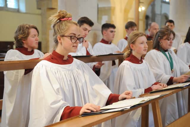 Hope Glew, 15, and some of the choristers rehearsing for Evensong at Portsmouth Cathedral. Picture: Habibur Rahman