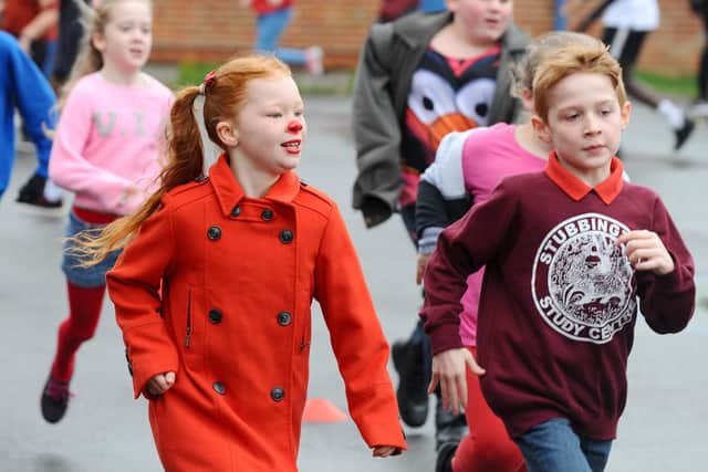 Summer-May Barham enjoys the fun run at Bedenham Primary School. Picture: Sarah Standing (150319-2728)