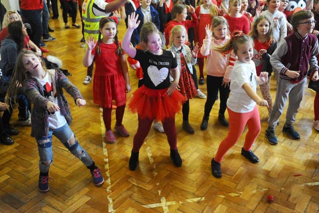 Tiya Channing, Lailani Owens and Amelia Matejko show off their moves in a dance session for Comic Relief at Bedenham Primary School. Picture: Sarah Standing (150319-1997)