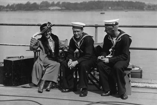 1935:  Actors John Mills, Betty Balfour (1903-1978) and Jimmy Hanley (1918-1970) take a break from filming 'Forever England' (aka 'Brown On Resolution', aka 'Born for Glory') on location in Portsmouth.  (Photo by Hulton Archive/Getty Images)