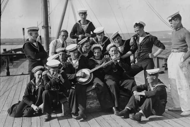 20th August 1936:  Sea Cadets on board the training ship HMS Implacable at Portsmouth harbour, amuse themselves by playing some tunes.  (Photo by E. Dean/Topical Press Agency/Getty Images)