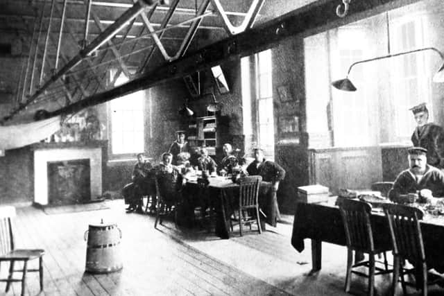 A view of the Petty Officers' Mess, Royal Navy barracks - notice the hooks for slinging hammocks. Photo: George Millener collection.