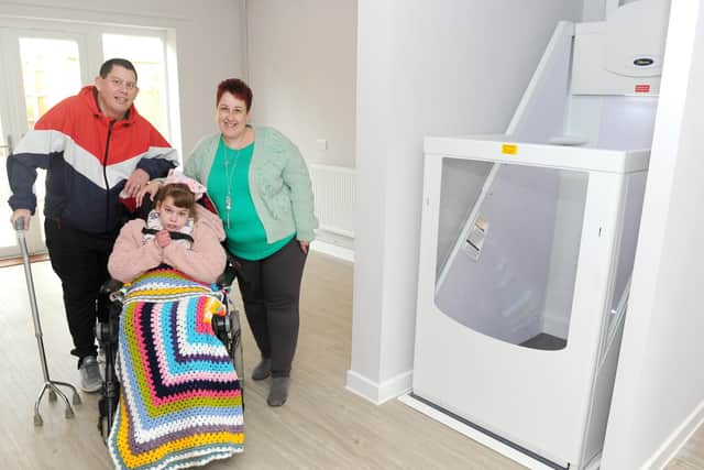Pictured is: Ian Rapson (43), Lisa Rapson (39) and daughter Danielle (13)  in their new home which they will move into on April 15.

Picture: Sarah Standing (180319-2376)