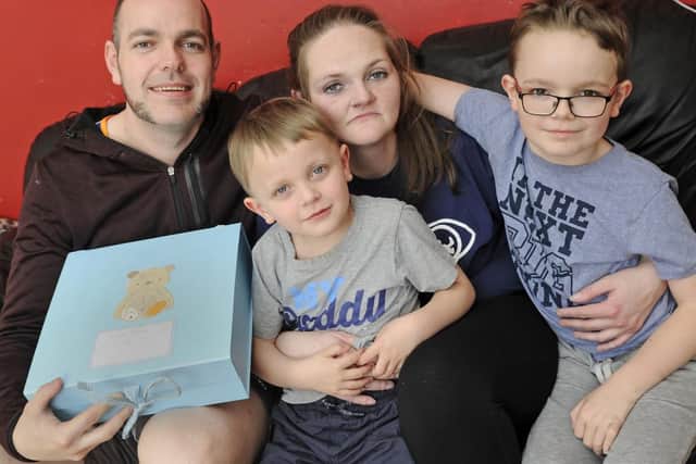 Shaun and Vicky Hoare, from West Leigh, with the Sands memory box and their two sons Shauny, left, and Alex, right. Picture: Ian Hargreaves (100319-3