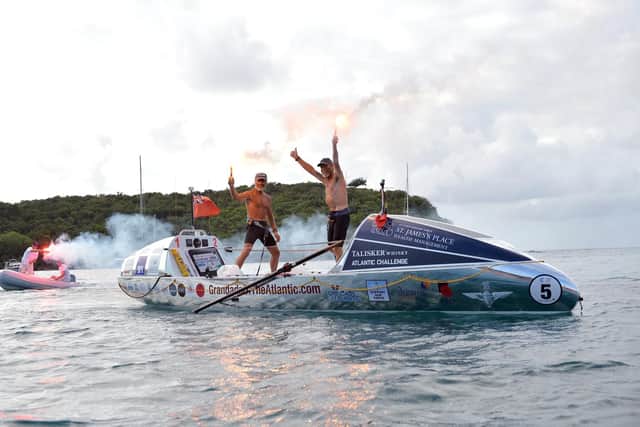 Peter Ketley and Neil Young celebrating after rowing across the Atlantic Picture: www.grandadsoftheatlantic.com