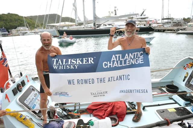 Peter Ketley right) and Neil Young celebrating their completion of the row across the Atlantic
Picture: www.grandadsoftheatlantic.com