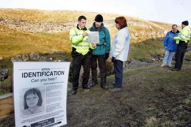 North Yorkshire Police supplied picture of officers seeking information from walkers on the Pennine Way regarding the unidentified woman whose body was found in a stream on the slopes of Pen-y-ghent in the Yorkshire Dales.