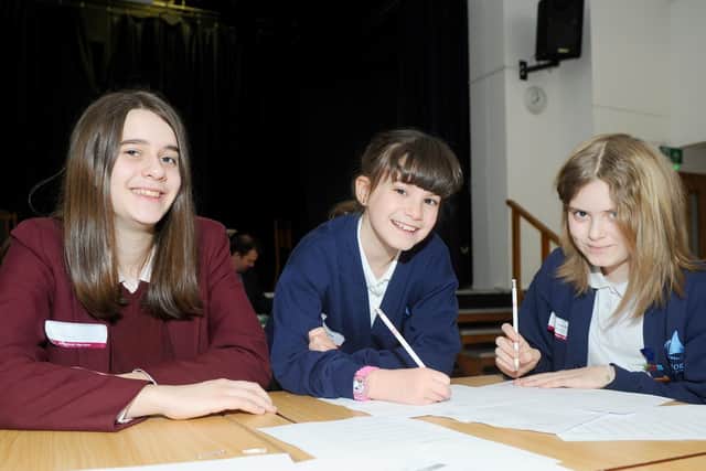 From left, Annalee Macfarlane, 15, from Portsmouth High School, with Ellie-Mai Clift, 10, and Lucy Burns, 11, from Emsworth Primary School.
Picture: Sarah Standing (190319-2468)