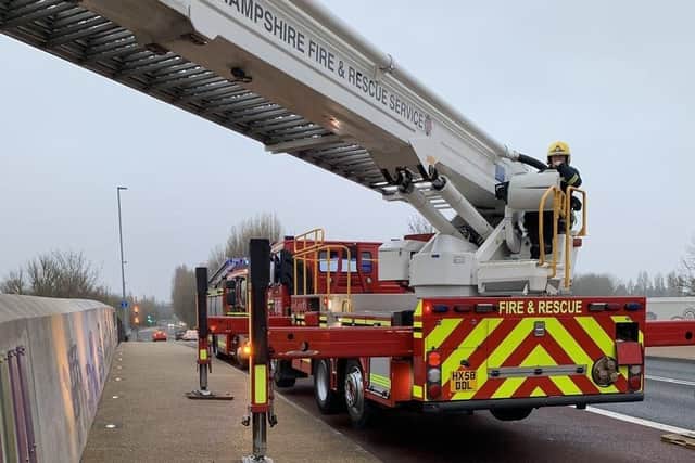 Fire crews helped rescue a casualty who fell from the Northern Road bridge in Cosham on to the railway embankment at 5.45am on March 21 in 2019. Picture: Twitter/@Cosham23
