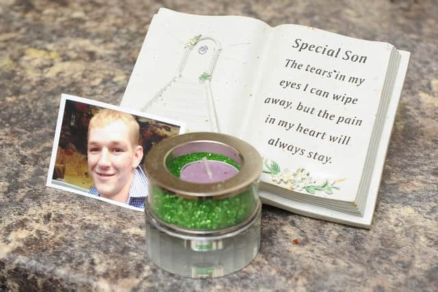 A picture of Ben Mills with a candle holder made of his ashes.
Picture: Habibur Rahman