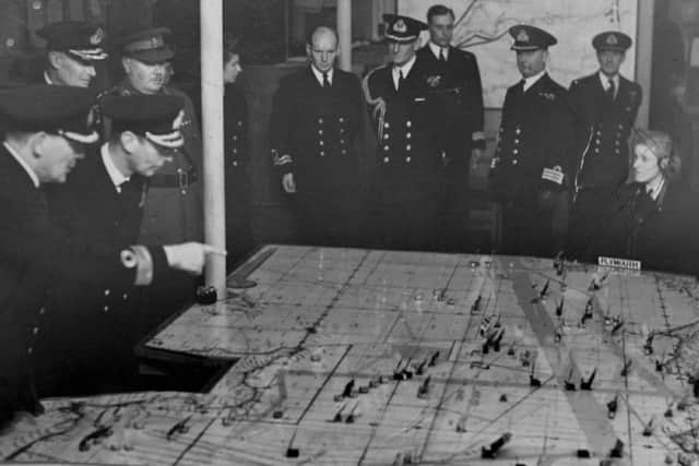 King George VI views the plotting table at Fort Southwick.