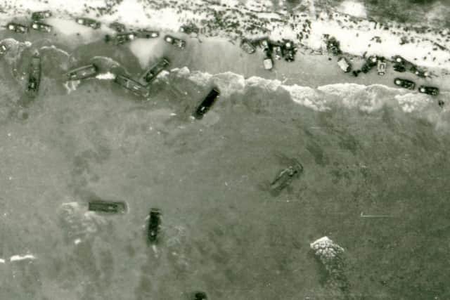 An aerial view of the D Day landings - one of a selection of aerial photographs taken by the RAF over Western Europe in the Second World War.  Archivists are marking the 60th anniversary of D-Day by releasing around 1,000 high-resolution aerial reconnaissance images taken by RAF crews before and during Operation Overlord.   The astonishing images - some of which depict the actual moment at which Allied troops set foot on the Normandy shoreline - are held at The Aerial Reconnaissance Archives (TARA) at Keele University in Staffordshire. PA Photo Aerial Reconnaissance Archives.