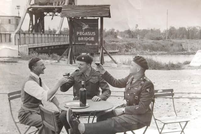 1946 photo of Pegasus Bridge with from left Georges Gondree the Proprietor of Cafe Gondree - now the Pegasus Bridge Cafe, Major John Howard DSO and Capt. David Wood. See PA story D-DAY Pegasus.  PA photo.