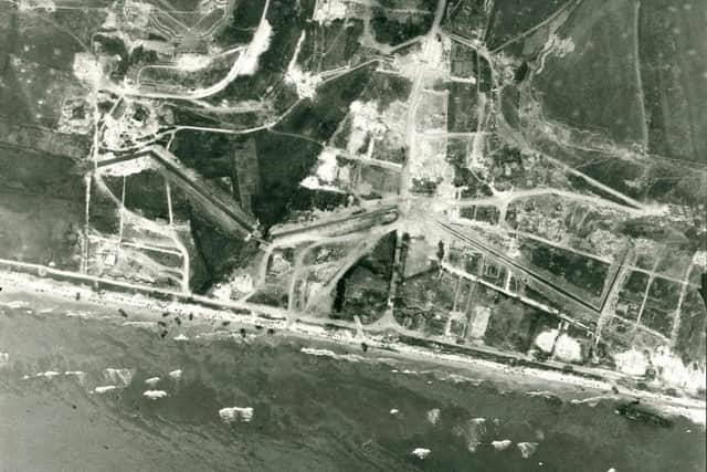 An aerial view of the D Day landings - one of a selection of aerial photographs taken by the RAF over Western Europe in the Second World War.  Archivists are marking the 60th anniversary of D-Day by releasing around 1,000 high-resolution aerial reconnaissance images taken by RAF crews before and during Operation Overlord.   The astonishing images - some of which depict the actual moment at which Allied troops set foot on the Normandy shoreline - are held at The Aerial Reconnaissance Archives (TARA) at Keele University in Staffordshire. See PA Story D-Day Aerial.  PA Photo Aerial Reconnaissance Archives.