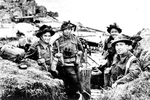Men of the 1st Battalion of the Hampshire Regiment occupy a German Gun position overlooking Arromanches DDay 6/6/44