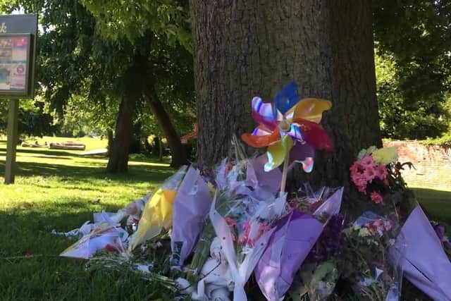 Flowers at the scene where the baby girl was found dead. Picture: Crimestoppers