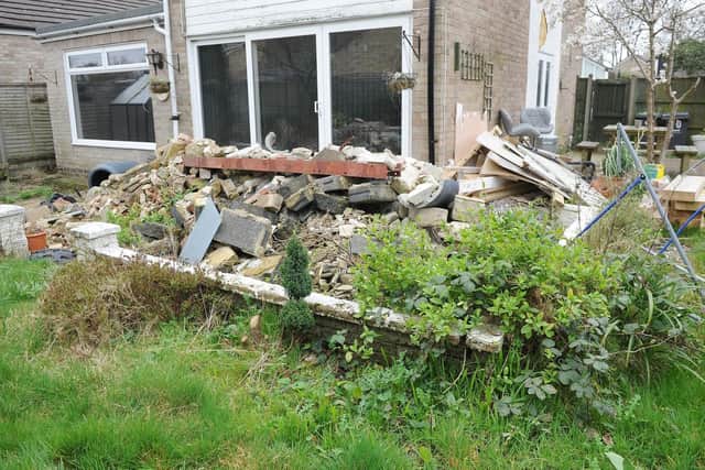 The mounds of rubble which need to be removed from the back garden of Ricky and Clarissa's Galaxie Road home, in Cowplain. Picture: Habibur Rahman