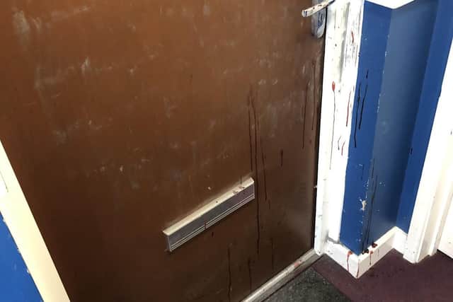 Blood was left across doors, walls and stairs in the flat complex.