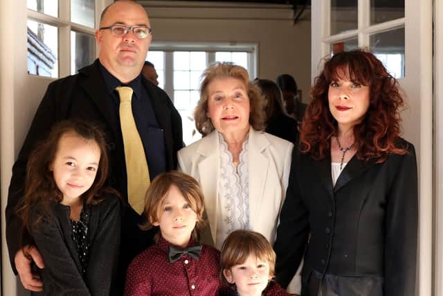 Elaine Shimbart, centre, with her children, Robert Shimbart and Sam Burgess, and her grandchildren after the memorial service for her late husband, Gerry, at St George's Church, Waterlooville. Picture: Chris Moorhouse (240319-)