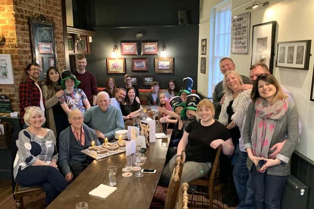 Bob smiling with all of his family at his party at The Golden Lion, Fareham.