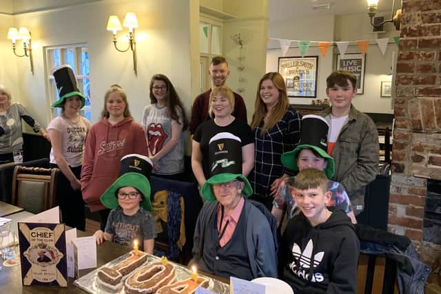 Bob sporting his St Patricks Day hat with his grandchildren.
