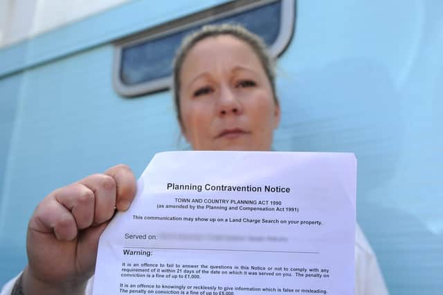 Becky Catchpowle outside her caravan with the letter that she received from Havant Borough Council
Picture: Habibur Rahman