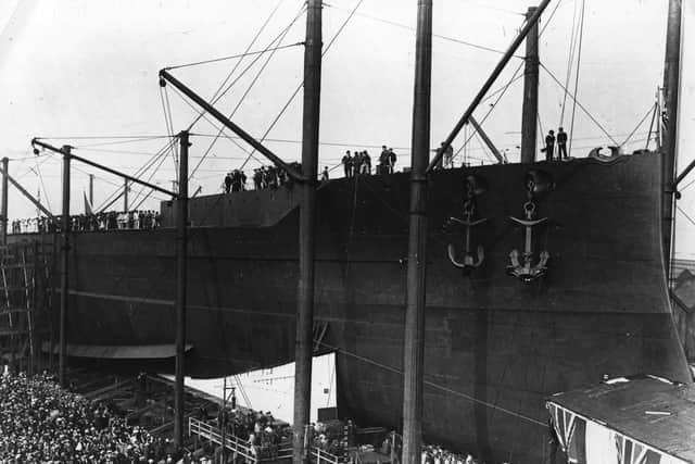 October 1913:  Spectators watching the launch of the Queen Elizabeth at Portsmouth.  (Photo by Topical Press Agency/Getty Images)