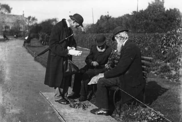 circa 1900:  Three old men convene around a bench in Portsmouth.  (Photo by Hulton Archive/Getty Images)