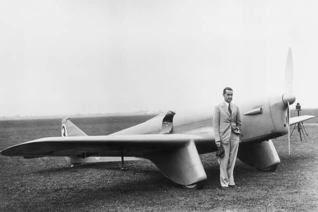 September 1936:  Air racer Victor Smith standing next to his Sparrowhawk aeroplane before the Portsmouth to Johannesburgh flight.  (Photo by H. Allen/Topical Press Agency/Getty Images)