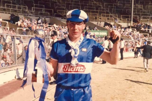 Warren Aspinall, later to play for Pompey, celebrates with the 1985 Freight Rover Trophy after Wigan had won the first Wembley final agains Brentford