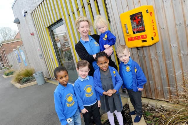 Pre-school manager Cathy Robinson, holding Florence Simmons, two, front, from left, Zavier Boyce, four, Oliver Bateman, four, Tiffany Famuditi, four, and Teddy Bruce Simmons, four
Picture: Sarah Standing (280319-4294)