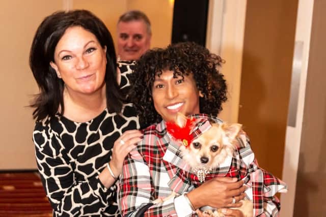 Mary Burgess with Lady Chelsea the chihuahua and her owner, Cesar Rapanut. Picture: Johnny Black