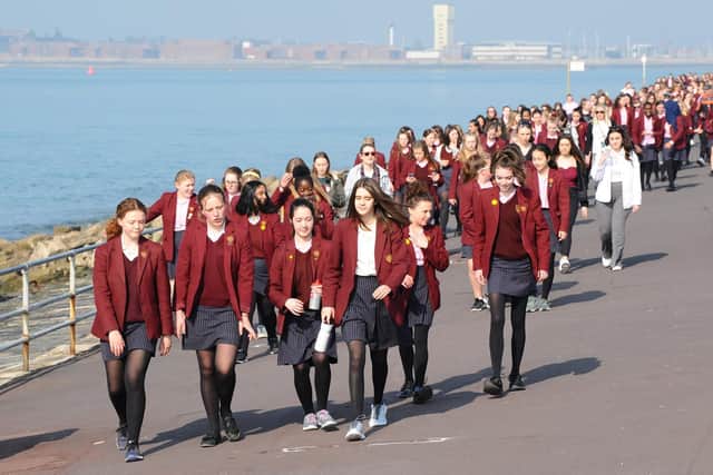 The Portsmouth High School students on the seafront 
Picture: Sarah Standing (290319-4305)