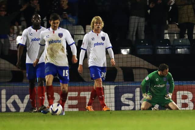 The Pompey players look dejected during their trip to Rochdale in March 2014