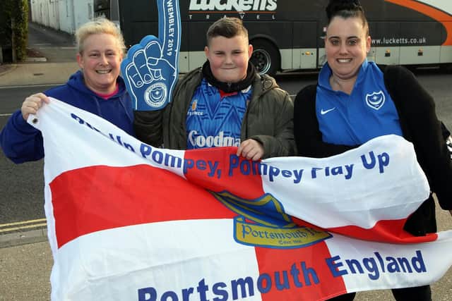 Emma Webber, Alfie Walker and Nadine Walker. Portsmouth FC fans making their way to Wembley with coach firm Lucketts. Picture by Innes Marlow