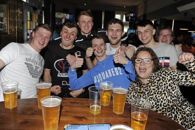 Fans celebrate at The Green Post in Portsmouth after Pompey beat Sunderland in the Checkatrade Trophy at Wembley. Picture: Ian Hargreaves  (310319-1)